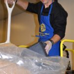 Nicholas Orscheln of Columbia Rotary (Downtown) shovels rice krispies.