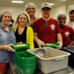 Members of Columbia Rotaract (left to right) Kate Gruenewald, Jolyn Sattizahn, Steven Stepanovic, Corbin Unstattd, Amadi Swartz and Josh Beck assist at the food bank.