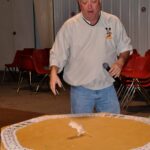 Tom Jones demonstrates mouse roulette before last year’s mouse races.